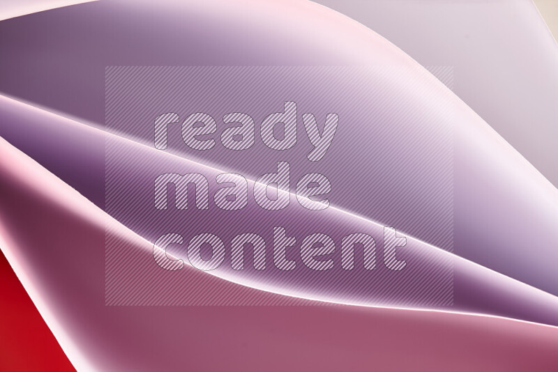 This image showcases an abstract paper art composition with paper curves in purple and pink gradients created by colored light