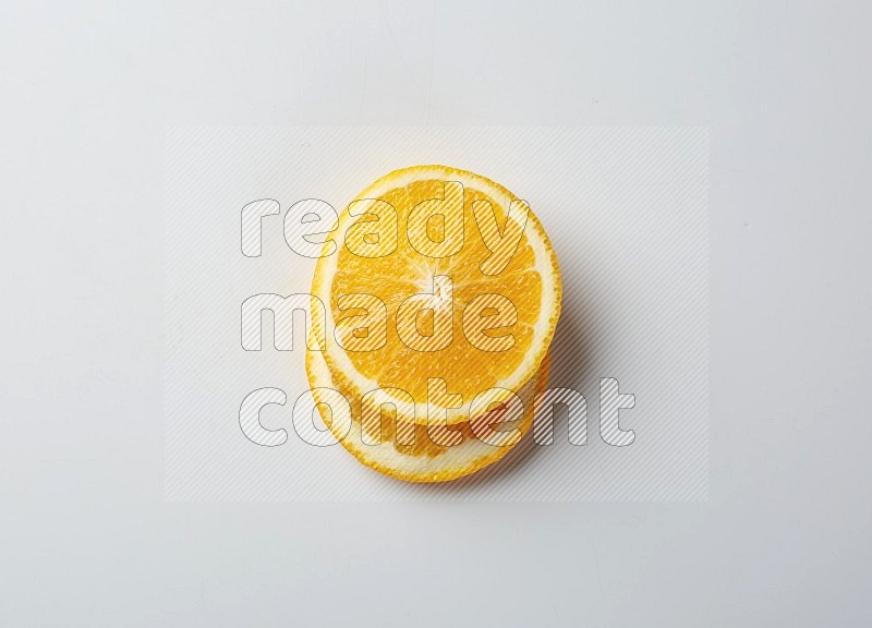 Two orange slices on white background