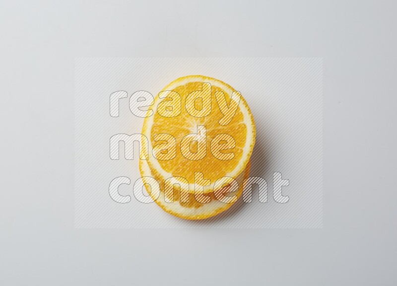 Two orange slices on white background