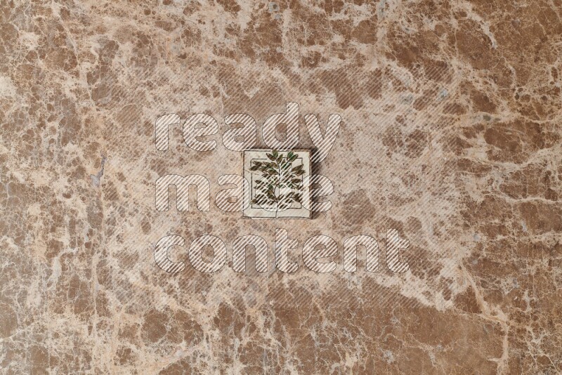 A decorative coaster on beige marble background