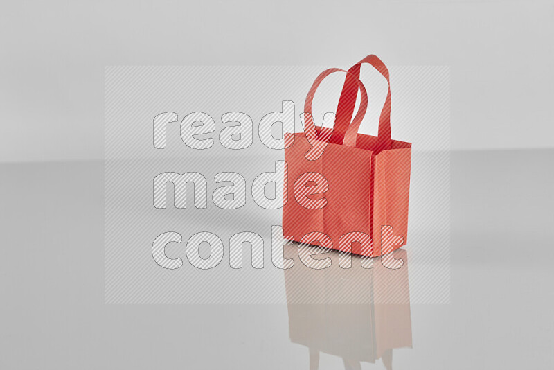 Origami shopping bag on grey background