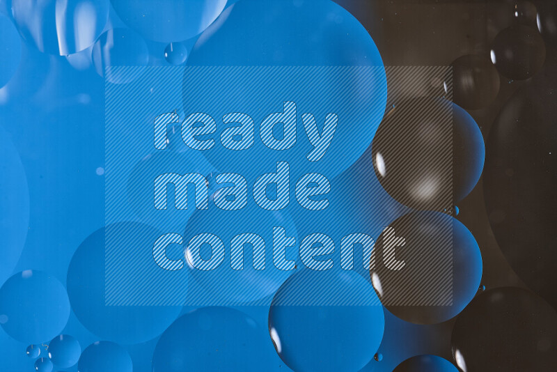 لقطات مقربة لفقاعات من الزيت على سطح الماء باللون الأزرق والبني