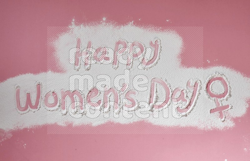 A sentence written with powder on pink background