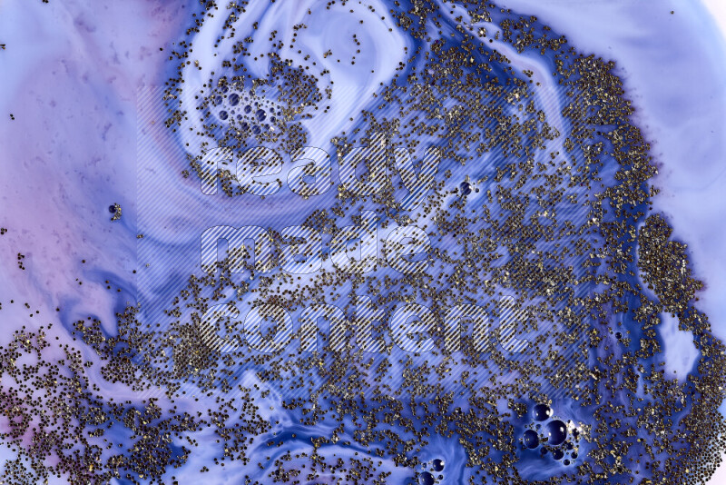 لقطة مقربة لبريق ذهبي متلألئ منتشر على خلفية من اللون الأزرق والأحمر في حركات دائرية