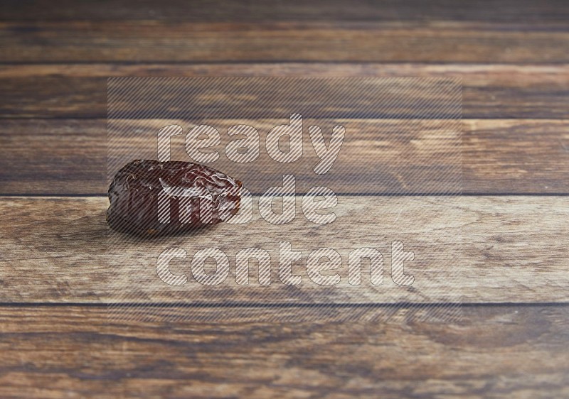 one madjoul date on a wooden background