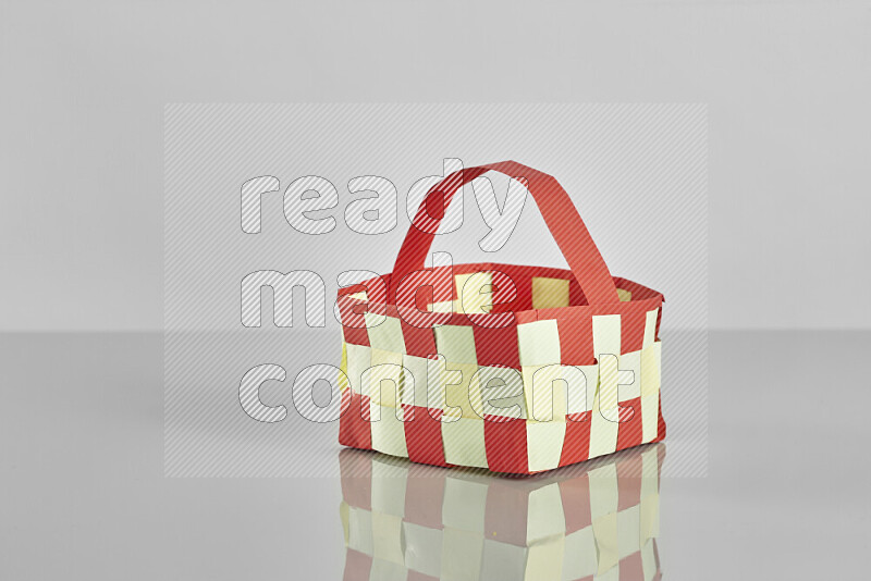 Origami easter basket on grey background