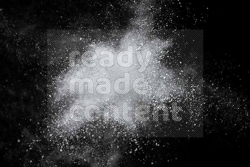 White powder explosion on black background