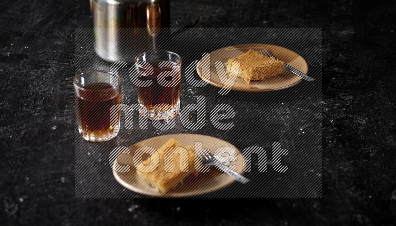 konafa with tea in a dark setup