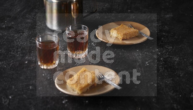konafa with tea in a dark setup