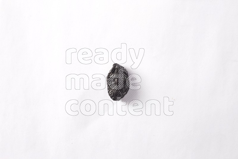 Dried plums on white background