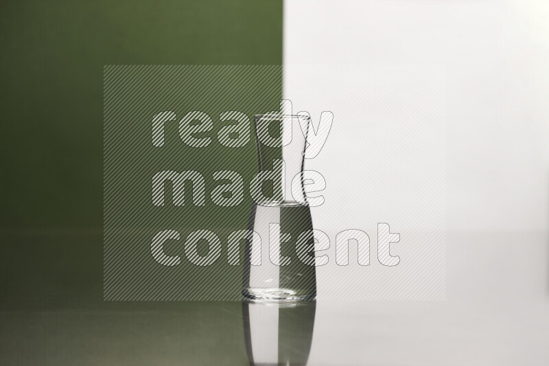 The image features a clear glassware filled with water, set against white and dark green background