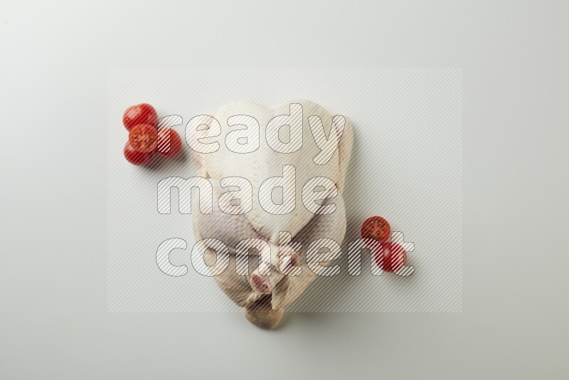 Whole fresh chicken direct on a white background