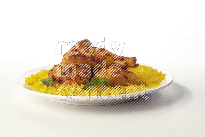 yellow basmati Rice with kabsa chicken pieces on a white rounded plate direct on white background