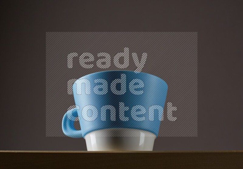 Low angle shot of a bicolor cup on grey background
