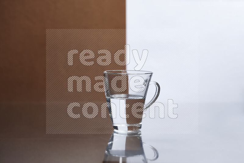 The image features a clear glassware filled with water, set against white and brown background