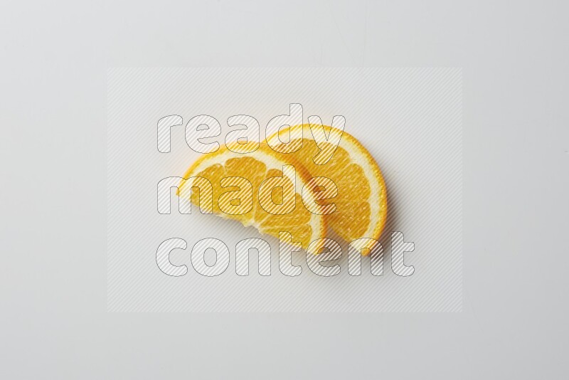 Two halves of an orange slices on white background