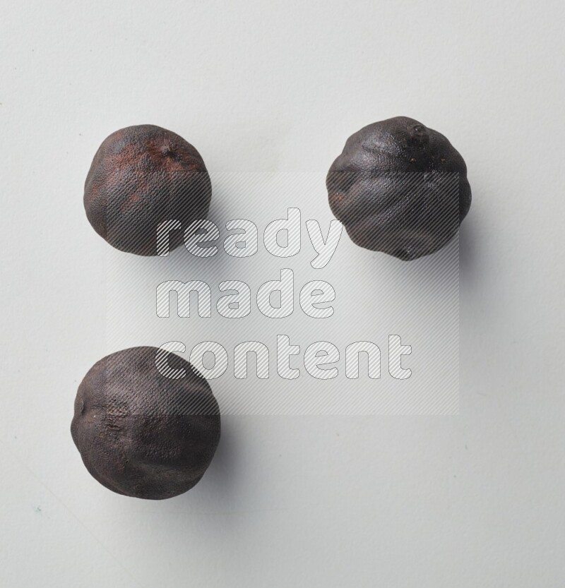 Top-view shot of dried lime (loomi) on white background