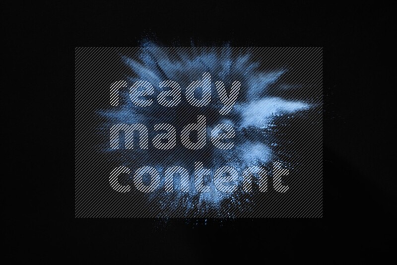 Blue powder explosion on black background