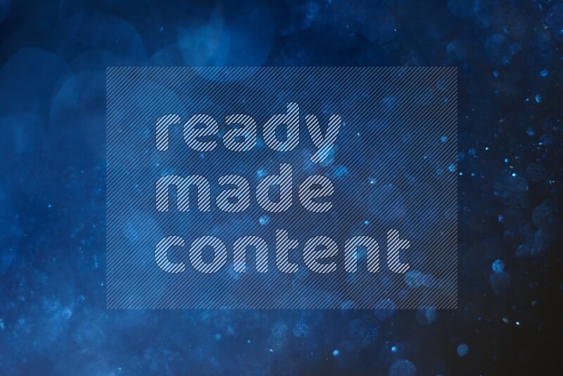 Blue glitter powder isolated on black background