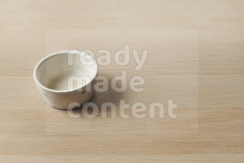 White Pottery Bowl on Oak Wooden Flooring, 45 degrees