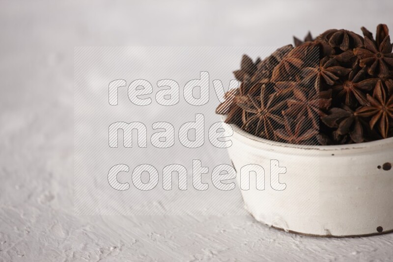 Star Anise in a white bowl on white background