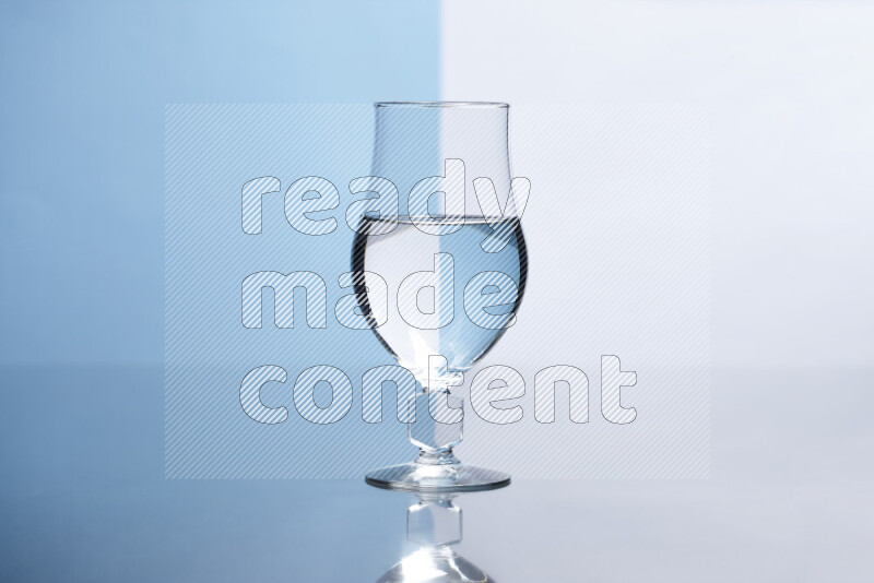 The image features a clear glassware filled with water, set against white and light blue background