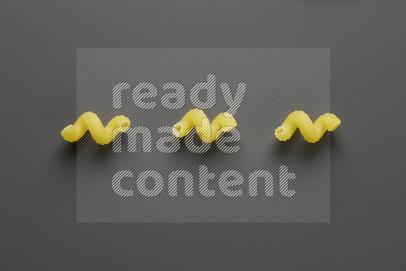 Twist pasta on grey background