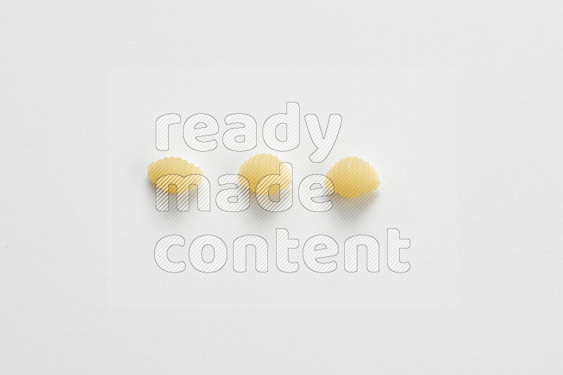 Shells pasta on white background