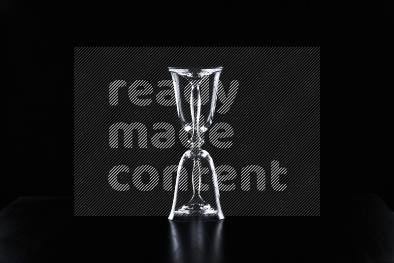 Glassware with rim light against black background