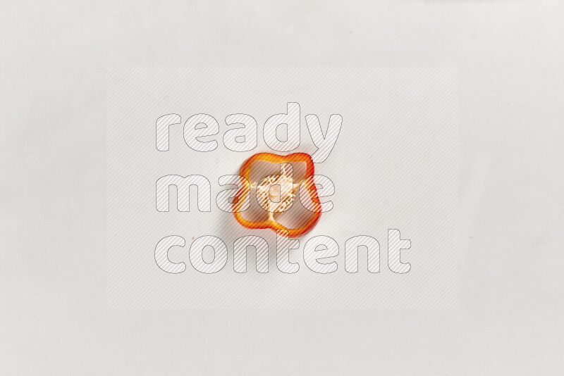 Red bell pepper slices on white background