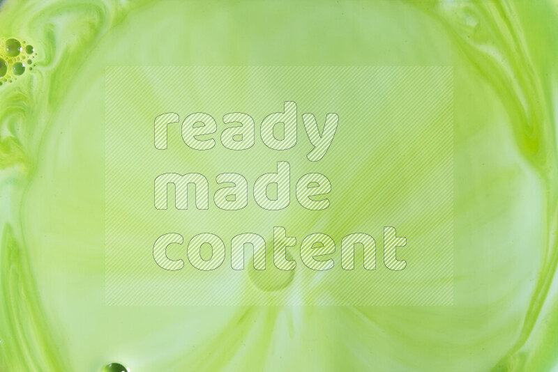 لقطة مقربة لأنماط دوامية بتدرجات اللون الأخضر