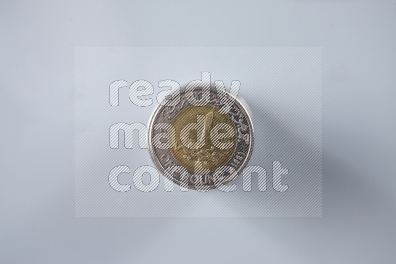 Stack Egyptian one pound coins on grey background