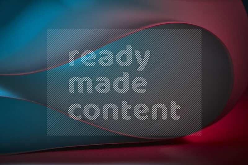 An abstract art piece displaying smooth curves in blue and red gradients created by colored light