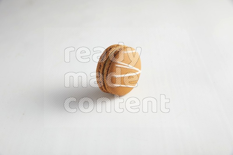 45º Shot of Brown Irish Cream macaron on white background