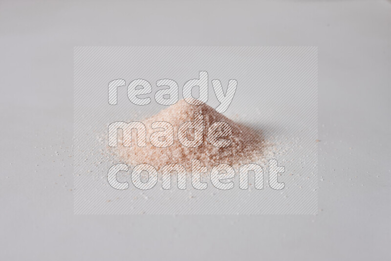 A bunch of fine himalayan salt on white background