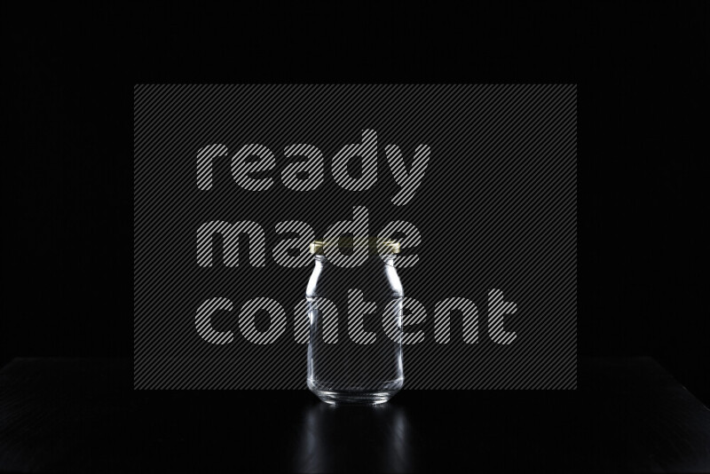 Glassware with rim light against black background