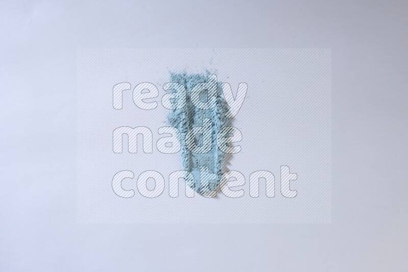 Blue powder strokes on white background