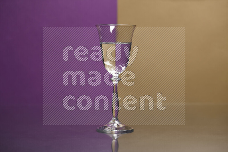 The image features a clear glassware filled with water, set against purple and beige background