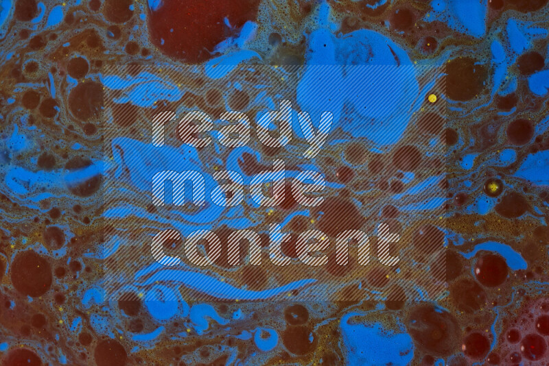 The image depicts a marbling effect with swirling patterns of red, blue and yellow
