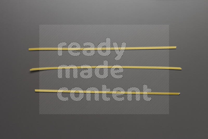 Linguini pasta on grey background