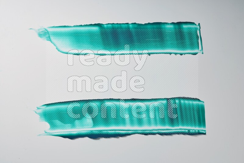 Turquoise painting knife strokes on white background