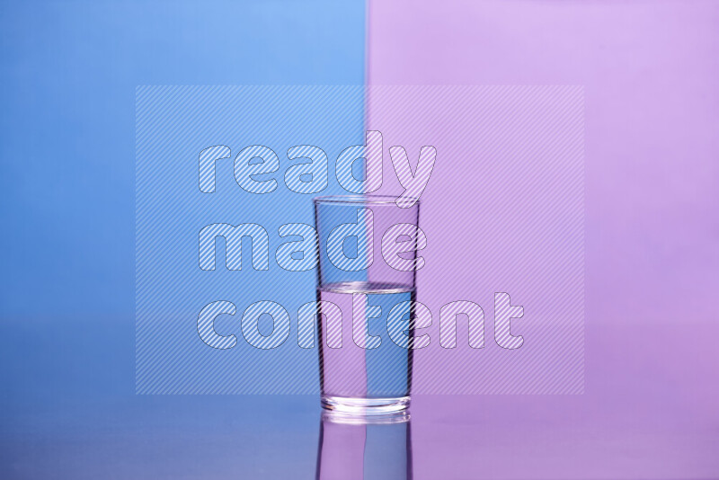 The image features a clear glassware filled with water, set against blue and light purple background