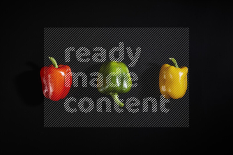 Assorted bell pepper on black background