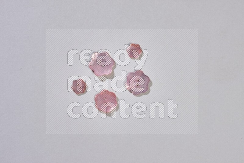 Mixed assorted buttons on grey background