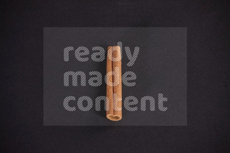 Cinnamon stick on black background