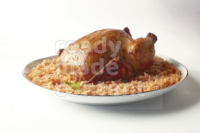 red basmati Rice with whole roasted chicken on a white plate with a silver rim direct on white background
