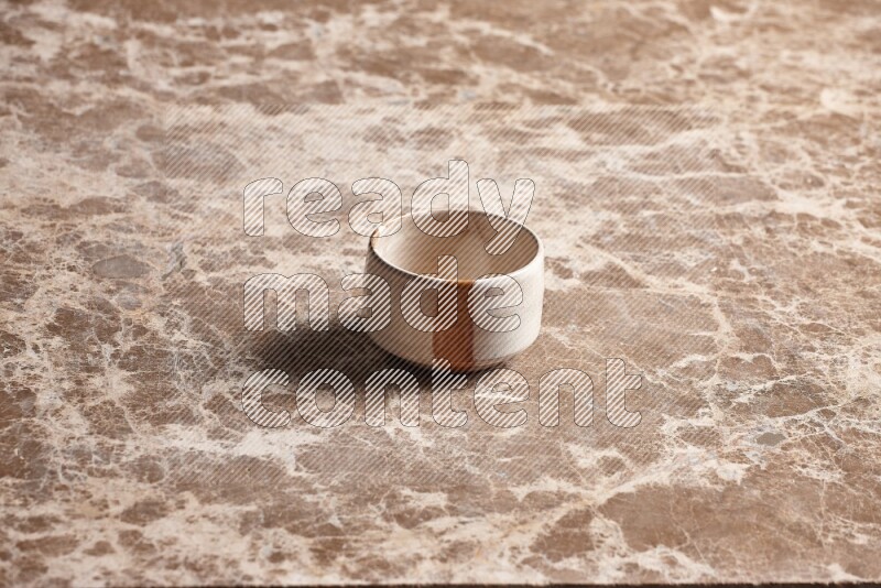 Multicolored Pottery Bowl on Beige Marble Flooring