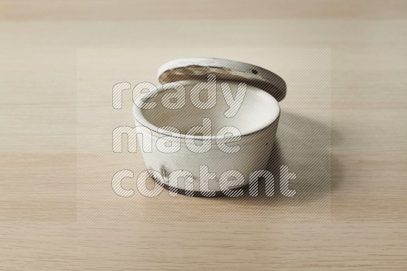 White Pottery Bowl on Oak Wooden Flooring, 15 degrees