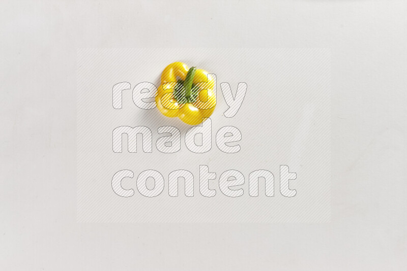 Yellow bell pepper slices on white background