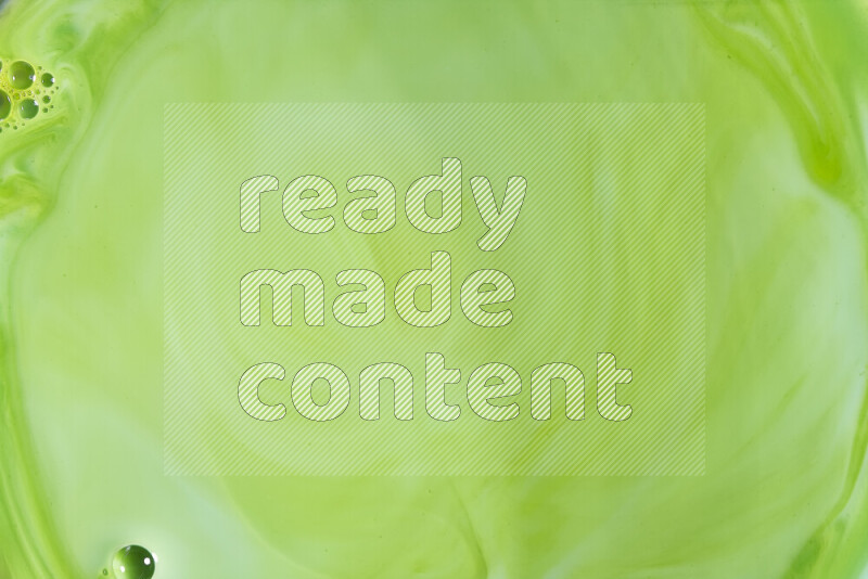 لقطة مقربة لأنماط دوامية بتدرجات اللون الأخضر